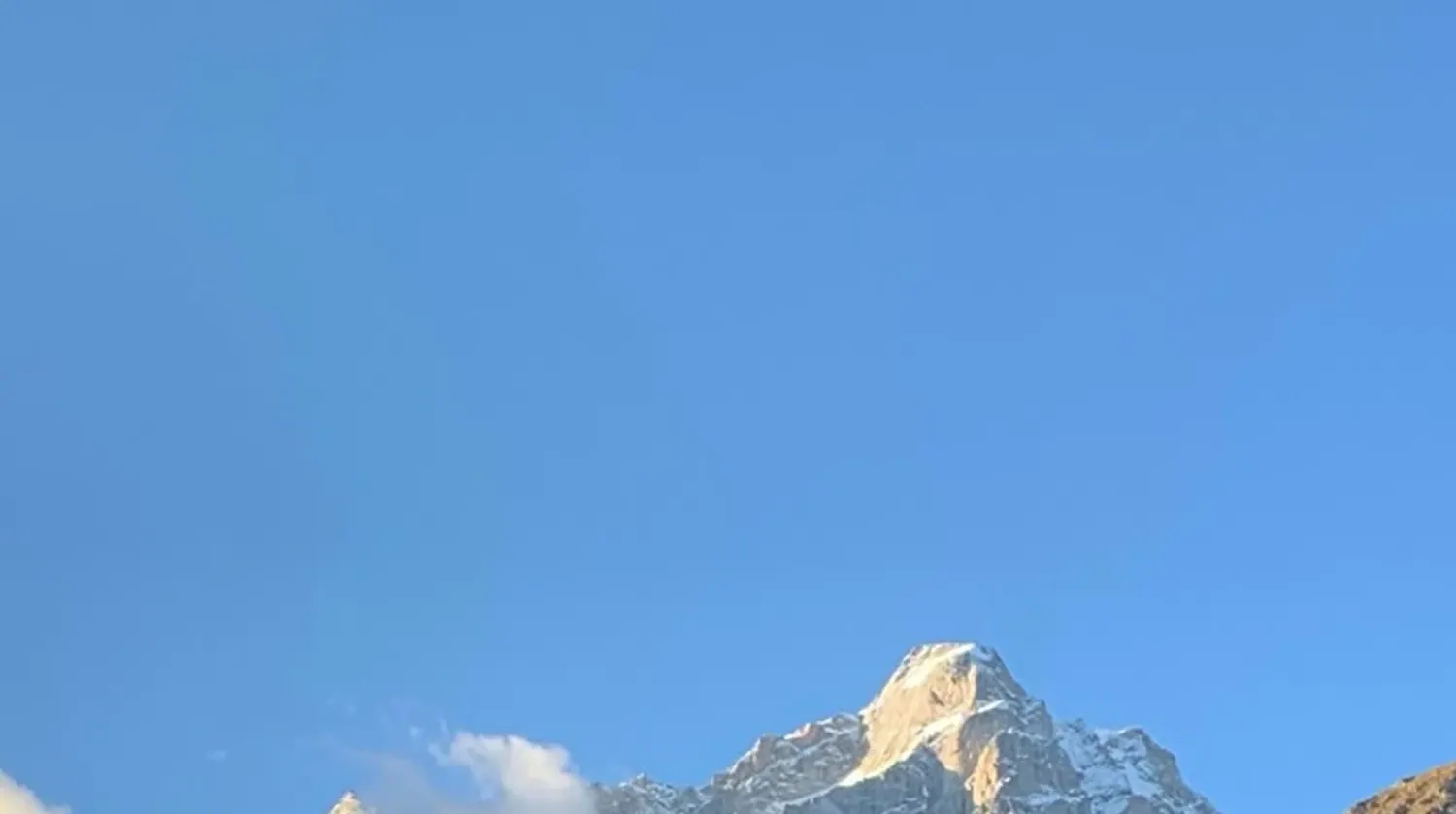 The peak above Rakchham at first light, seen from the valley floor